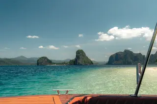 Snorkelers over Linapacan reef — clearest water in the Philippines
